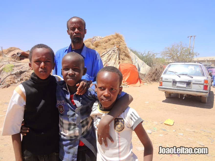 Friendly man and children in Hargeisa animal market 