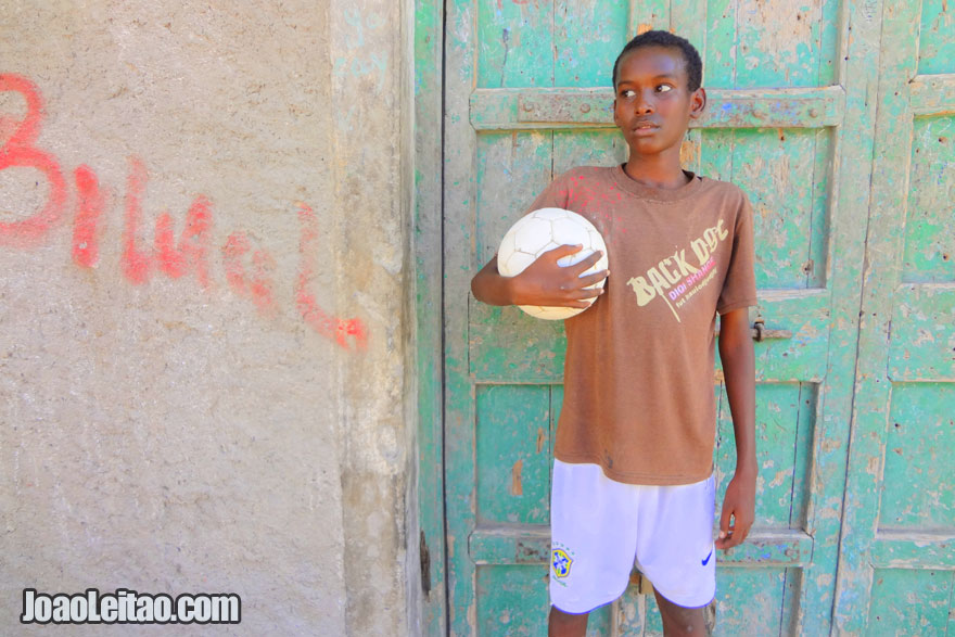 Kid with football in Berbera coastal city in the Gulf of Aden